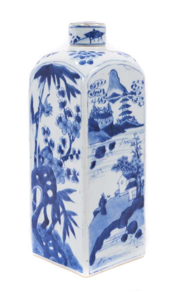 Lot 67 - Rare Chinese blue and white square gin/spirit bottle and cover, Kangxi (1662-1722), two sides decorated with a figure in a landscape scene, the other two with bamboo, prunus and a bird, floral spra...
