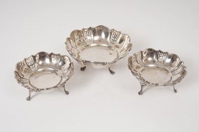 Lot 308 - Matched set of two small and one larger, George V silver bon-bon dishes of circular form