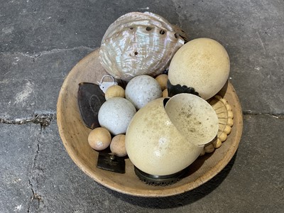 Lot 247 - Collection of nine ivory billiard balls, each approximately 4.5cm diameter, together with two ostrich eggs on stands, shells and other items, in a sycamore dairy bowl