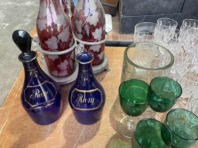 Lot 258 - Decorative glassware including three bottle cranberry glass decanter stand, Regency Bristol blue decanters, engraved Jewish glass, engraved Masonic glass