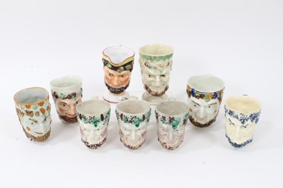 Lot 12 - Group of nine 18th and early 19th century Staffordshire Satyr-mask jugs, including Whieldon and Pratt type examples, 9cm to 12.5cm high