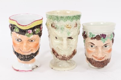 Lot 12 - Group of nine 18th and early 19th century Staffordshire Satyr-mask jugs, including Whieldon and Pratt type examples, 9cm to 12.5cm high