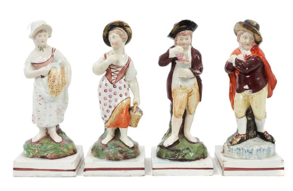 Lot 13 - Set of four Staffordshire Pearlware-glazed figures, early 19th century, emblematic of the seasons, on red-lined square bases, 19cm high