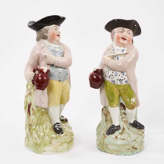 Lot 15 - Two Pearlware-glazed 'Hearty Good Fellow' Toby jugs