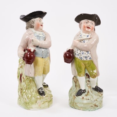Lot 137 - Two Pearlware-glazed 'Hearty Good Fellow' Toby jugs