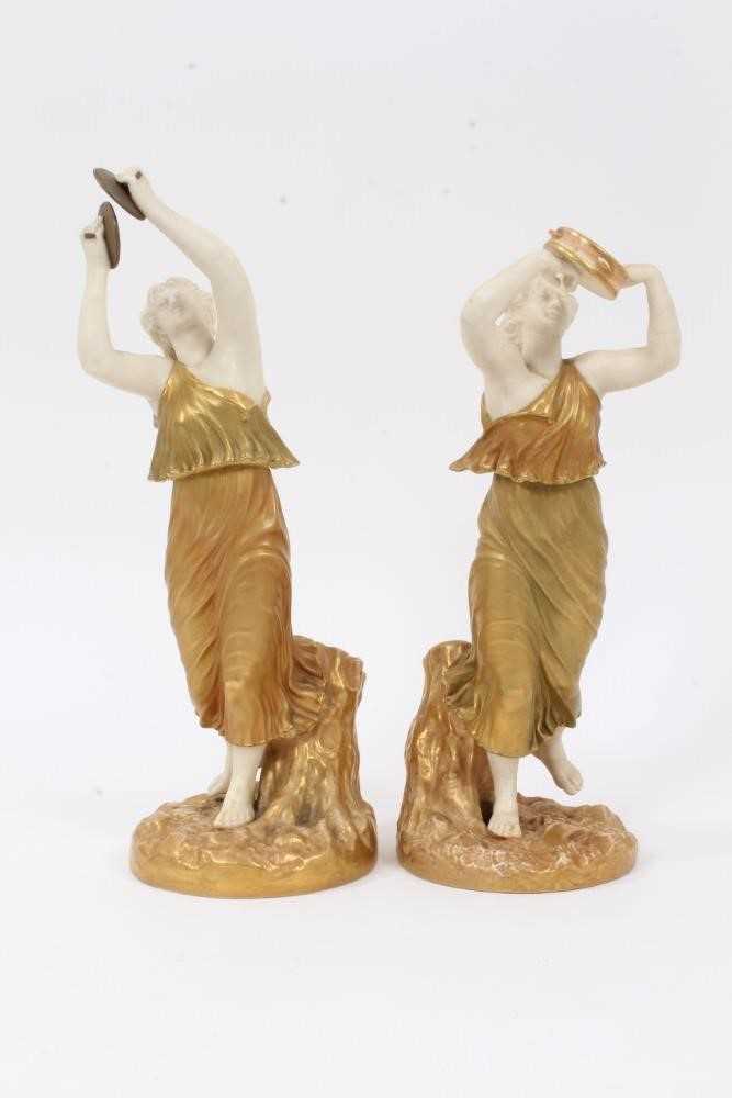 Lot 51 - Pair of Royal Worcester blush ivory figures of musicians