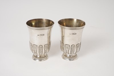 Lot 366 - Pair of Carrington & Co silver cups/beakers with applied cut and pierced card strapwork decoration London 1916