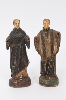 Lot 787 - An 18th century carved wood, and polychrome decorated, standing figure of a Saint in Monk’s habit, together with another similar, in Holy vestments and stole, both with carved bone heads (arms miss...