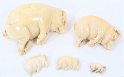 Lot 790 - Five Victorian carved ivory sleeping “Lucky Pigs”, of different sizes, one without ears signed Lucky Pig (7.8cm), another slightly smaller, signed Barratt & Sons, Piccadilly, RD 434873 (5.2cm) thre...