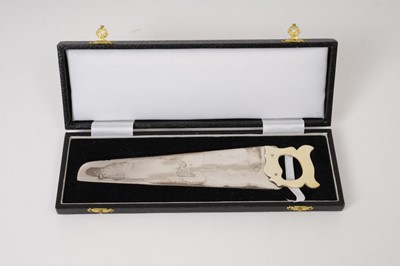Lot 252 - Cased Victorian silver cucumber saw with engraved Armorial crest and carved ivory handle