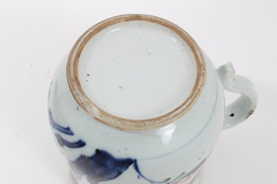 Lot 42 - Chinese export porcelain tankard, late 18th century, of baluster form, painted in underglaze blue and enamels with flowering and fruiting branches, 15.75cm high