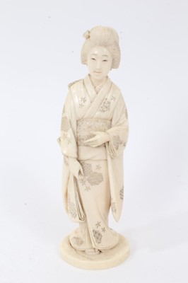 Lot 734 - Good quality late 19th century Japanese carved ivory figure of girl in traditional dress carrying a folded fan