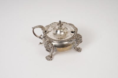 Lot 230 - George V silver mustard pot of cauldron form, with gadrooned border, leaf mounted scroll handle