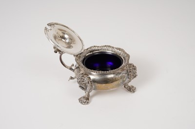 Lot 230 - George V silver mustard pot of cauldron form, with gadrooned border, leaf mounted scroll handle