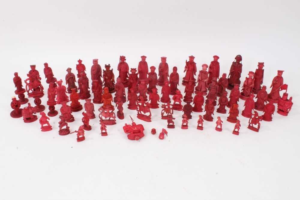 Lot 722 - Collection of 19th century Chinese carved red stained ivory chess pieces, comprising various elements of various sets the tallest approximately 11cm