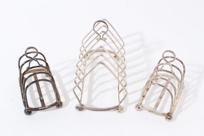 Lot 238 - Pair 1920s small silver four division toast racks of hooped form, and one other (3)