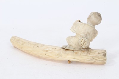Lot 224 - Chinese export carved ivory puzzle ball, 5.5cm diameter, raised on pierced and carved stand, together with a group of Japanese ivory okimo, with missing elements