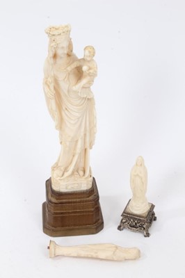 Lot 766 - 19th century carved Dieppe ivory figure of a Mother and Child, raised on carved fruitwood base, 18cm high, together with two small carvings of Mary. (3)