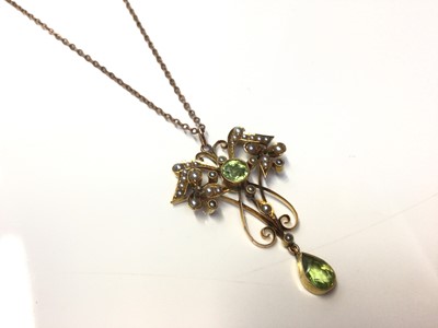 Lot 43 - Edwardian 15ct gold peridot and seed pearl open work pendant on chain