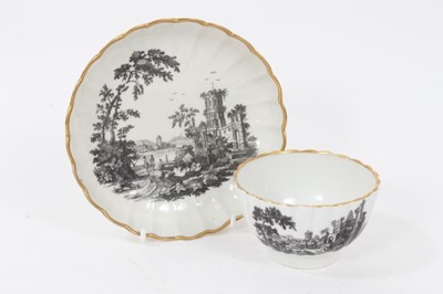 Lot 157 - A Worcester fluted tea bowl and saucer, printed with ruins, circa 1770