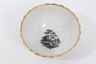 Lot 103 - A Worcester fluted tea bowl and saucer, printed with ruins, circa 1770