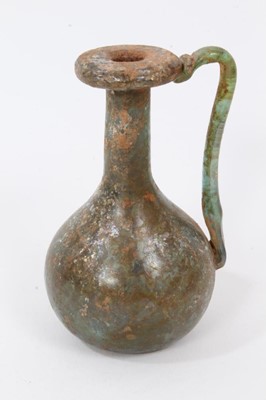 Lot 198 - Roman glass jug, 9.5cm