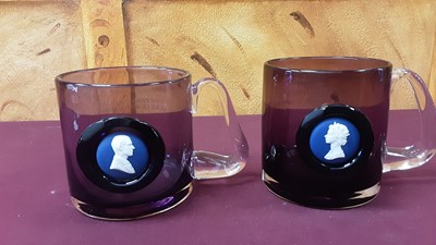 Lot 1143 - Pair of Wedgwood amethyst glass tankards set with Wedgwood jasperware panels commemorating the Silver Jubilee 1952-1977, with profile busts of Queen Elizabeth II and Prince Phillip Duke of Edinburg...