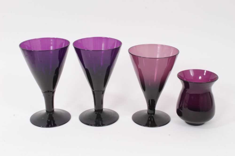 Lot 106 - Three 19th century amethyst tinted flared glasses, and a similar tulip shaped cup