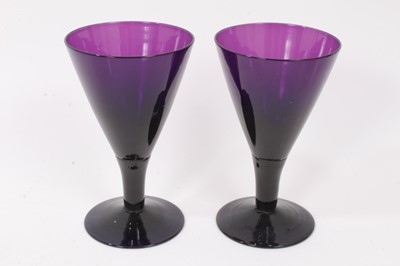 Lot 106 - Three 19th century amethyst tinted flared glasses, and a similar tulip shaped cup