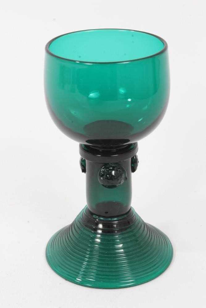 Lot 112 - A George III green tinted wine glass, in German style
