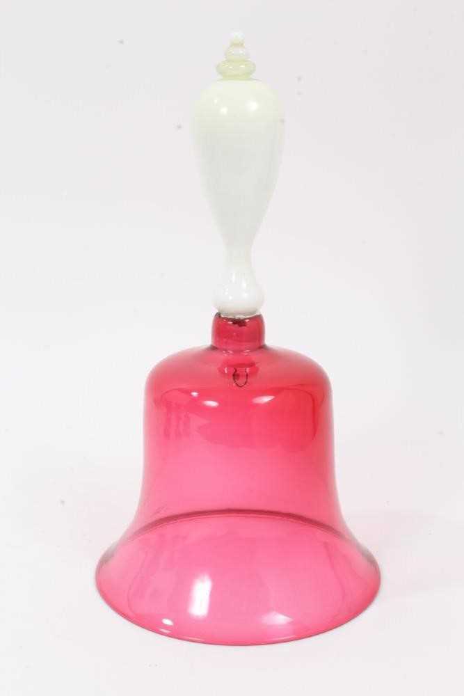 Lot 120 - A Victorian cranberry tinted glass bell