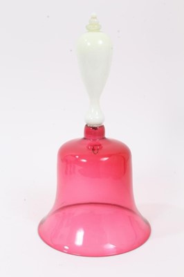 Lot 154 - A Victorian cranberry tinted glass bell