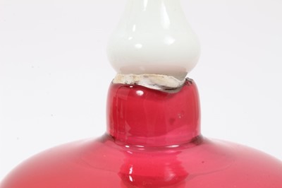 Lot 120 - A Victorian cranberry tinted glass bell