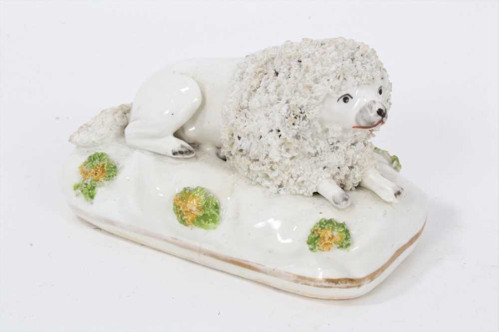 Lot 175 - A Staffordshire porcelain model of a recumbent poodle, circa 1830-40