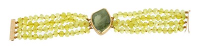 Lot 479 - Gold and green stone four-strand bracelet with central green stone panel and four strings of faceted beads on 18ct gold clasp, 16.5cm length