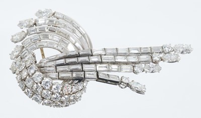Lot 410 - Diamond brooch with a stylized scroll and waterfall design with articulated tassel drops, with brilliant cut, marquise cut and baguette cut diamonds in 18ct white gold setting. Estimated total diam...