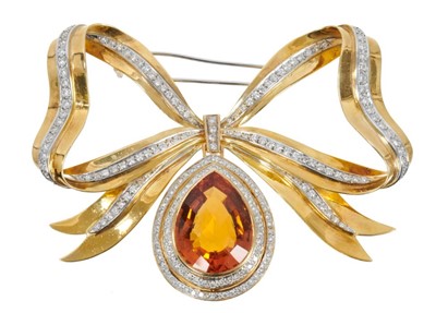Lot 440 - Large citrine, diamond and 18ct gold bow brooch with a large fancy cut pear-shape citrine surrounded by brilliant cut diamonds suspended from an 18ct yellow gold and diamond ribbon bow, approximate...