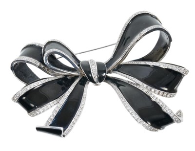 Lot 460 - Large diamond and black enamel bow brooch, the black enamel ribbons with brilliant cut diamond borders in 18ct white, sponsor's mark A&W, Birmingham 2008. Approximately 90mm.