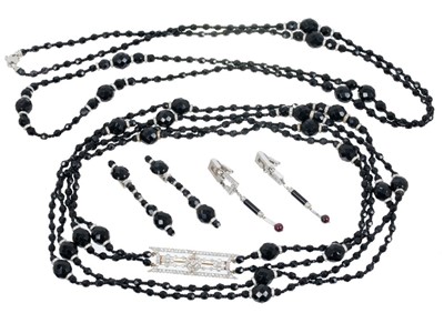 Lot 457 - Edwardian style diamond and black onyx bead necklace with a long double-strand of faceted onyx beads with diamond spacers, the central panel incorporating an Edwardian Belle Époque diamond plaque b...