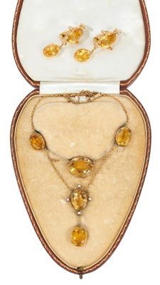 Lot 463 - Edwardian citrine and seed pearl necklace with oval mixed cut stones in gold rub over settings, together with a pair of pendant earrings.