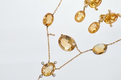 Lot 463 - Edwardian citrine and seed pearl necklace with oval mixed cut stones in gold rub over settings, together with a pair of pendant earrings.