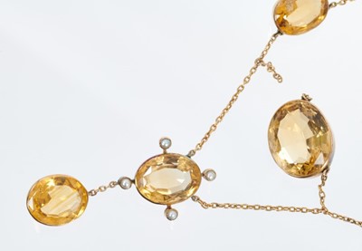 Lot 463 - Edwardian citrine and seed pearl necklace with oval mixed cut stones in gold rub over settings, together with a pair of pendant earrings.