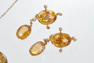 Lot 463 - Edwardian citrine and seed pearl necklace with oval mixed cut stones in gold rub over settings, together with a pair of pendant earrings.