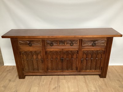 Lot 1077 - Large sideboard with carved decoration