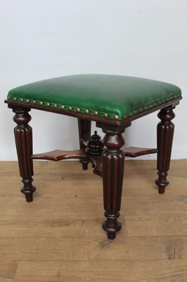 Lot 1437 - Victorian mahogany leather upholstered stool, with square cushion seat on fluted legs and spool feet united by X-shaped stretcher