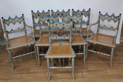 Lot 1439 - Set of eight Regency style painted and caned dining chairs, each with pierced and arched Gothic back