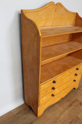 Lot 1440 - Regency style maple and painted open bookcase, with arched gallery and open shelves, three drawers below on shaped frieze, 92cm wide x 30cm deep x 130cm high