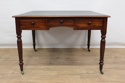 Lot 1496 - Early 19th century mahogany library table standing on turned legs