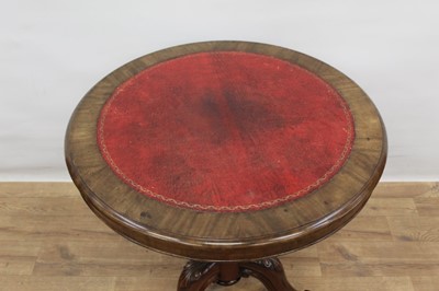Lot 1497 - 19th century circular library table with leather insert to top, standing on good carved base