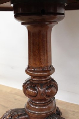 Lot 1497 - 19th century circular library table with leather insert to top, standing on good carved base